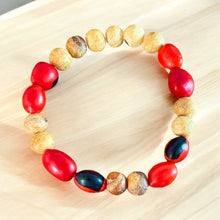 Load image into Gallery viewer, Handcrafted Bracelet with Palo Santo and Huayruro Seeds | Made from Ethically Sourced Palo Santo and Authentic Huayruro Seeds | Symbolizes Good Luck, Protection, and Positive Energy
