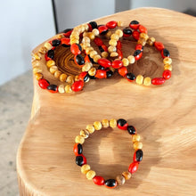 Load image into Gallery viewer, Handcrafted Bracelet with Palo Santo and Huayruro Seeds | Made from Ethically Sourced Palo Santo and Authentic Huayruro Seeds | Symbolizes Good Luck, Protection, and Positive Energy
